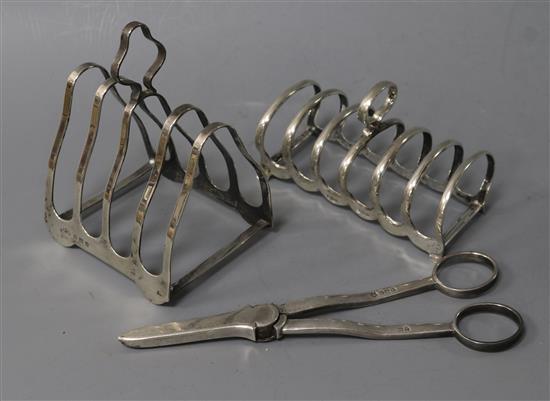 Two 20th century silver toast racks and a pair of silver grape shears.